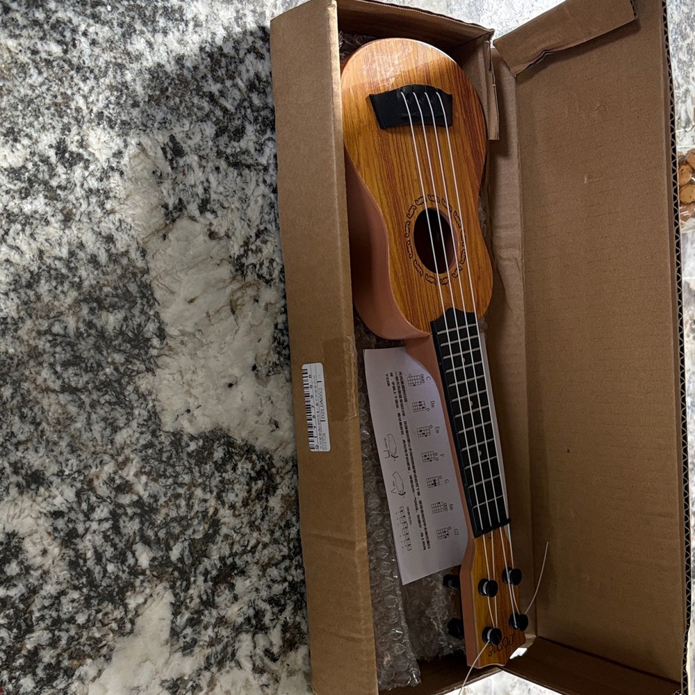 Wooden Ukulele with Black Strings